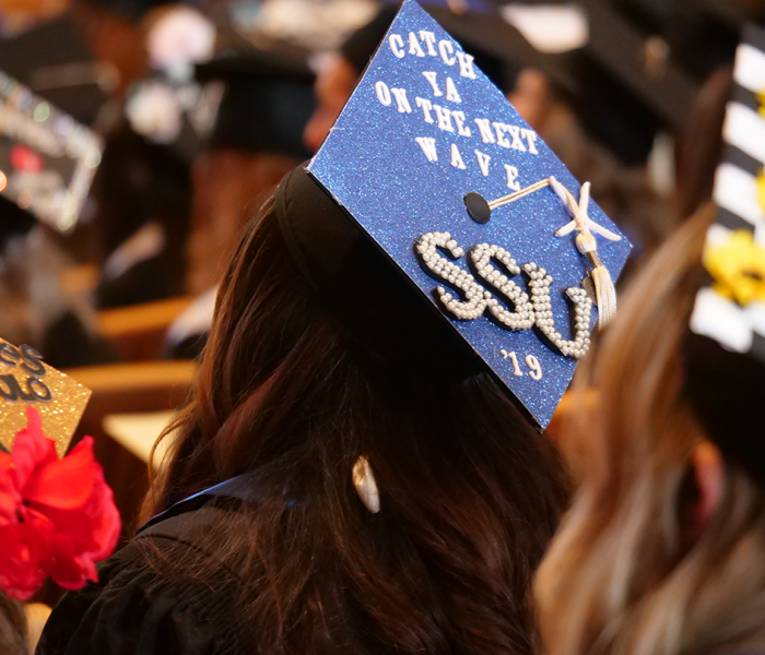 3 decorated mortar board caps