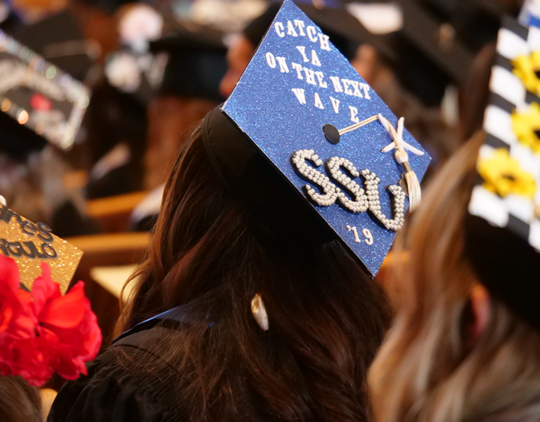 3 decorated mortar board caps