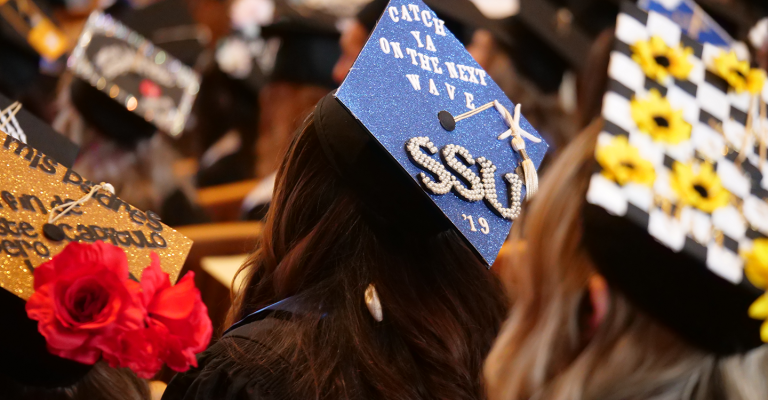 3 decorated mortar board caps